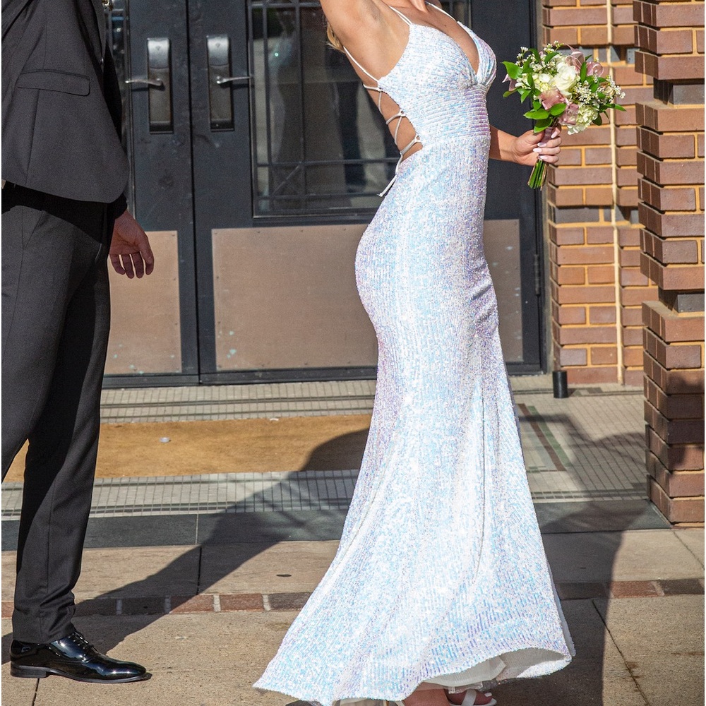 Sherri Hill white iridescent gown with back lace detail and partial slit